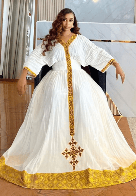 Elegant Habesha Kemis – Ethiopian Traditional White Cotton Dress with T'el'e't Embroidery | ETH_W - 0005Women'sKaba StoreKaba Store1XSAll agesElegant Habesha Kemis – Ethiopian Traditional White Cotton Dress with T'el'e't Embroidery | ETH_W - 0005
