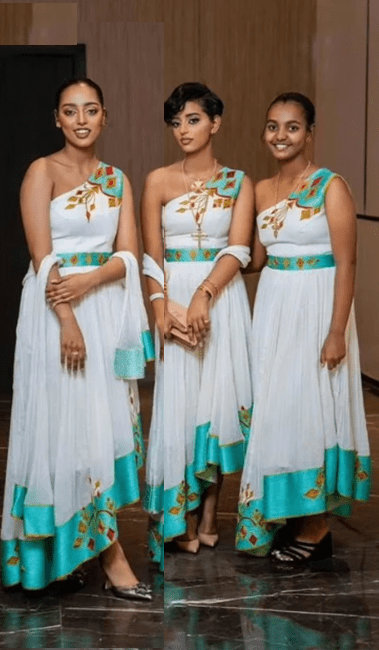 🌟 Modern Bridal Party Habesha Kemis – Matching One - Shoulder Dresses with Teal & Gold T'el'e't Embroidery | ETH - GM_0004Group MatchingKaba StoreKaba StoreXS🌟 Modern Bridal Party Habesha Kemis – Matching One - Shoulder Dresses with Teal & Gold T'el'e't Embroidery | ETH - GM_0004