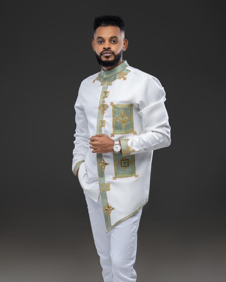 Modern Ethiopian Elegance: Men's White Suit with Teal & Gold Tillet | ETH_M - 0003Men's WearKaba StoreKaba StoreETH_M-0003XSCustomizableModern Ethiopian Elegance: Men's White Suit with Teal & Gold Tillet | ETH_M - 0003