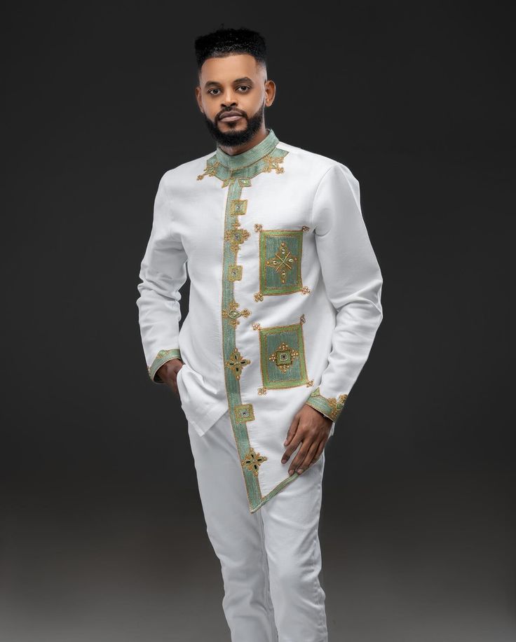 Modern Ethiopian Elegance: Men's White Suit with Teal & Gold Tillet | ETH_M - 0003Men's WearKaba StoreKaba StoreETH_M-0003XSCustomizableModern Ethiopian Elegance: Men's White Suit with Teal & Gold Tillet | ETH_M - 0003