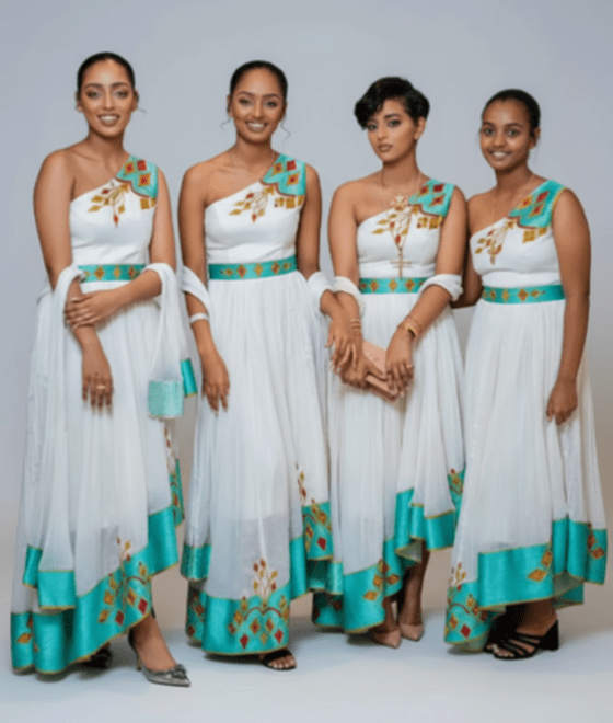 🌟 Modern Bridal Party Habesha Kemis – Matching One - Shoulder Dresses with Teal & Gold T'el'e't Embroidery | ETH - GM_0004Group MatchingKaba StoreKaba StoreXS🌟 Modern Bridal Party Habesha Kemis – Matching One - Shoulder Dresses with Teal & Gold T'el'e't Embroidery | ETH - GM_0004