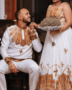 Regal Union: Ethiopian Wedding Couple's Attire in Gold and White Tillet | ETH_Cp - 0001CouplesKaba StoreKaba StoreXSAll agesCustomizableEthiopian Wedding Couple's Attire in Gold and White Tillet Ethiopian traditional clothes Habesha Kemis Ethiopian dress Habesha dress Ethiopian Men's Suit Habesha Suit Ethiopian clothing Habesha clothing 